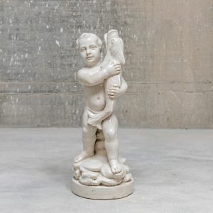 Ceramic fountain with a boy holding a fish